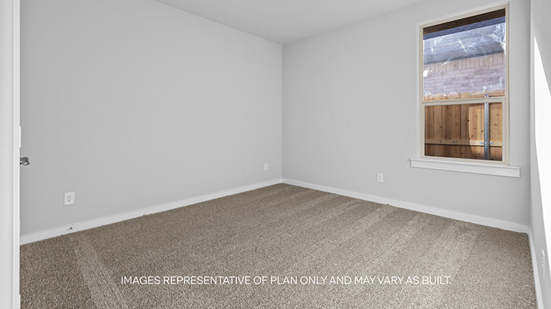 guest bed with plush carpet and spacious closet