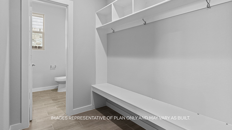 mud room with wooden shelving