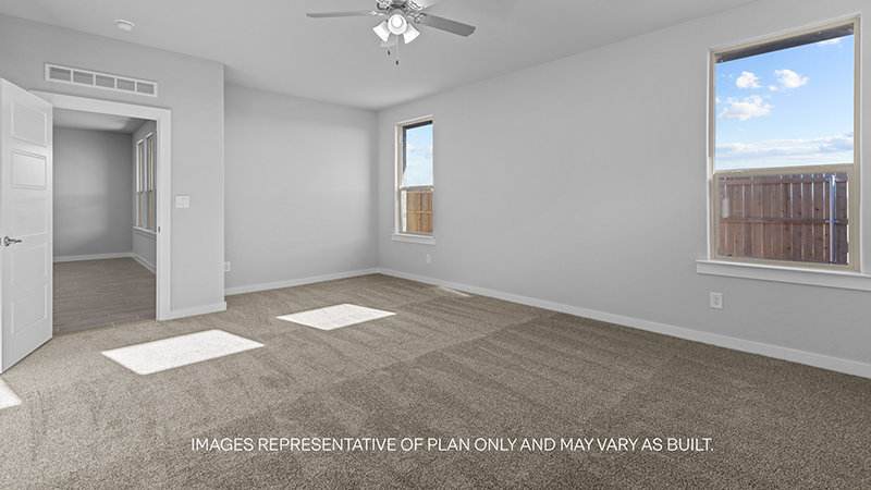 primary bedroom with plush carpet and attached bathroom