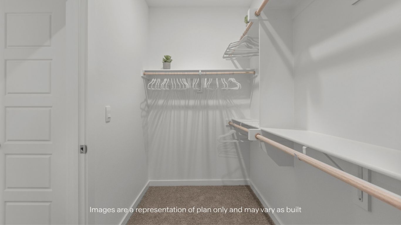 Primary walk-in closet with extra storage space