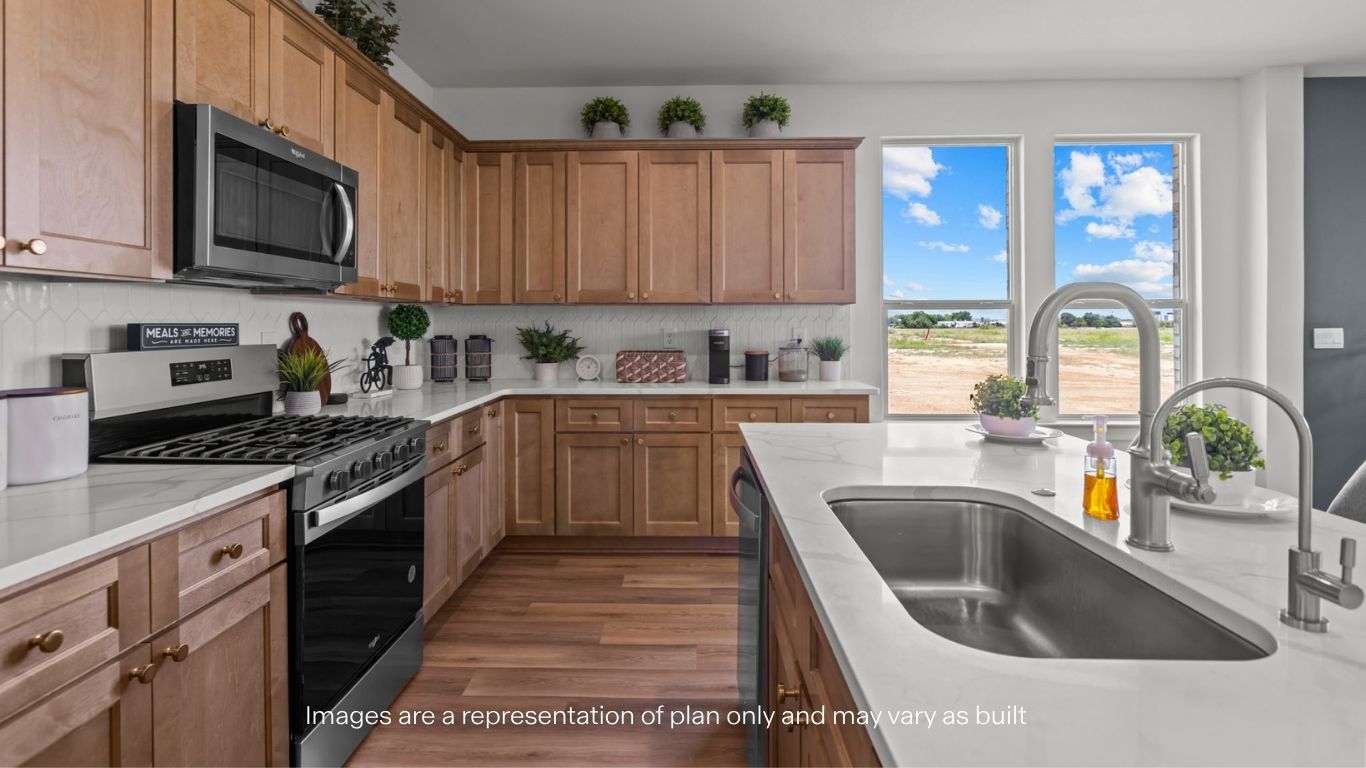 Open concept kitchen with stainless steel appliances, shaker style cabinets, and elevated finishes
