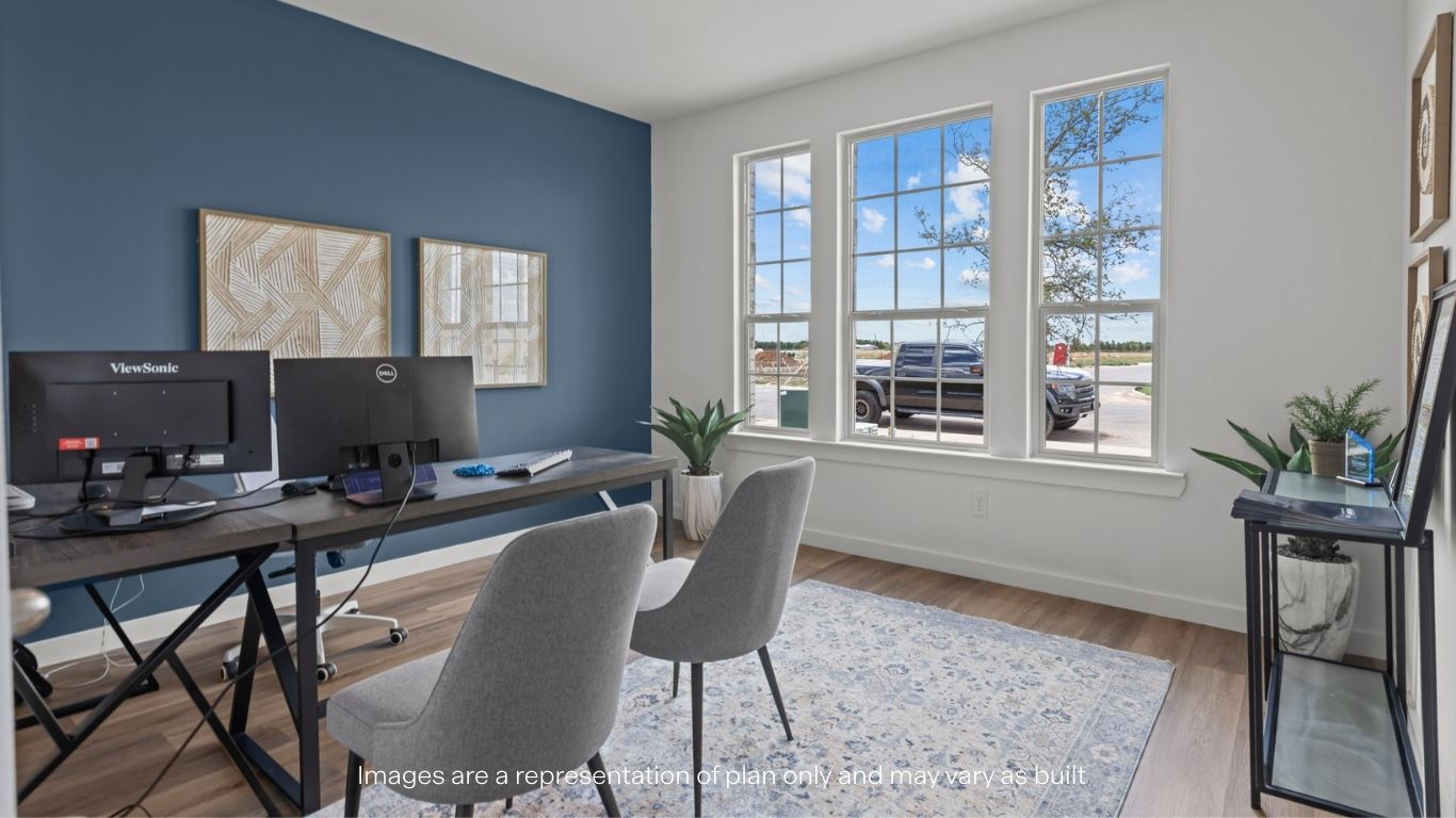 Guest bedroom 1 with front windows and ample natural light