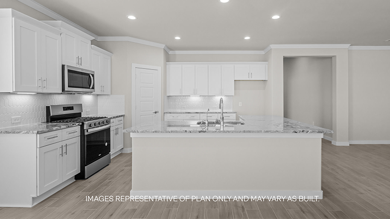 kitchen with spacious island, quartz counters and stainless-steel appliances