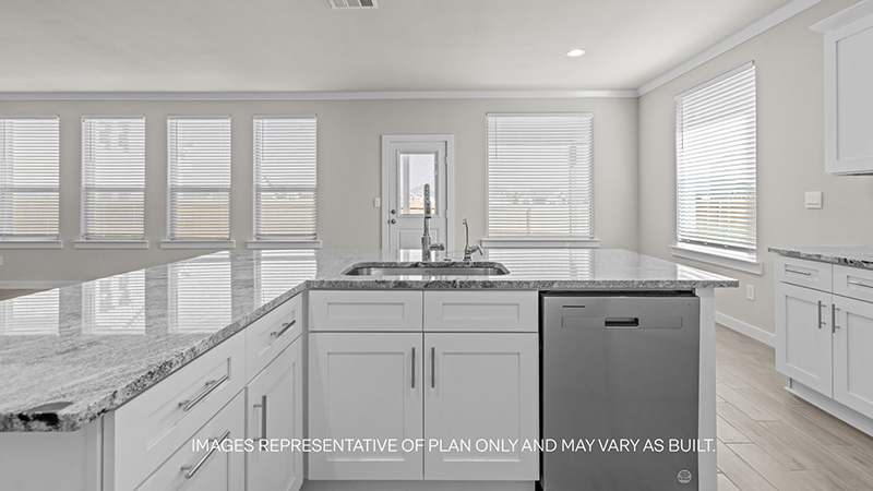 kitchen with spacious island, quartz counters and stainless-steel appliances