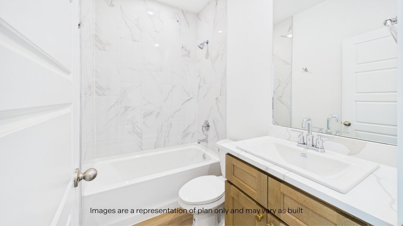 Downstairs guest bathroom with built in vanity and combination bathtub shower