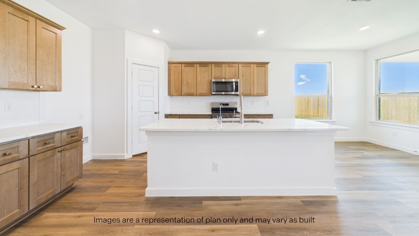 Spacious open concept kitchen with island and counter prep space