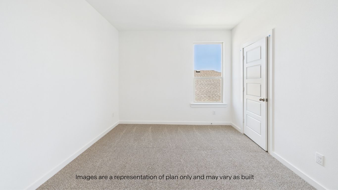 Guest bedroom 2 with side window and plush carpet floor