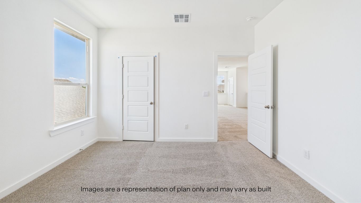 Guest bedroom 2 with side window and plush carpet floor