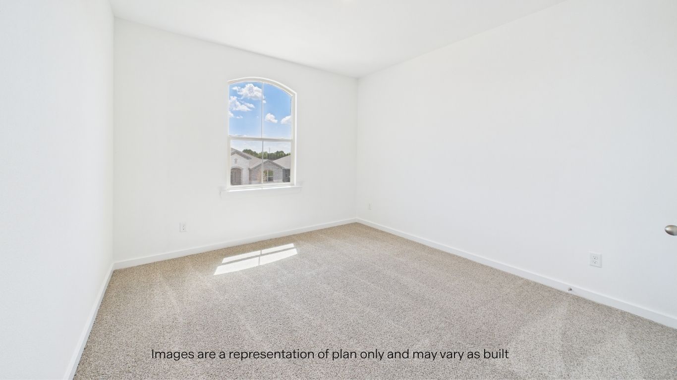 Upstairs Guest bedroom 3 with front window and plush carpet floors
