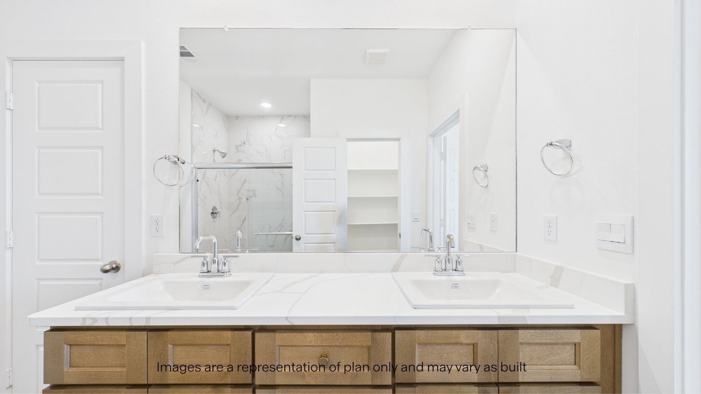 Primary bathroom with luxurious shower and built in storage