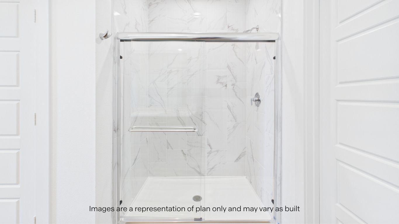 Primary bathroom with built in vanity and luxurious shower
