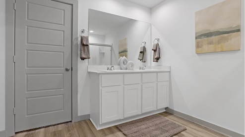Double vanity in the bathroom with white cabinets