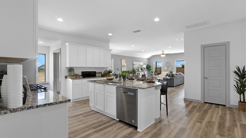 Kitchen with white cabinets and island