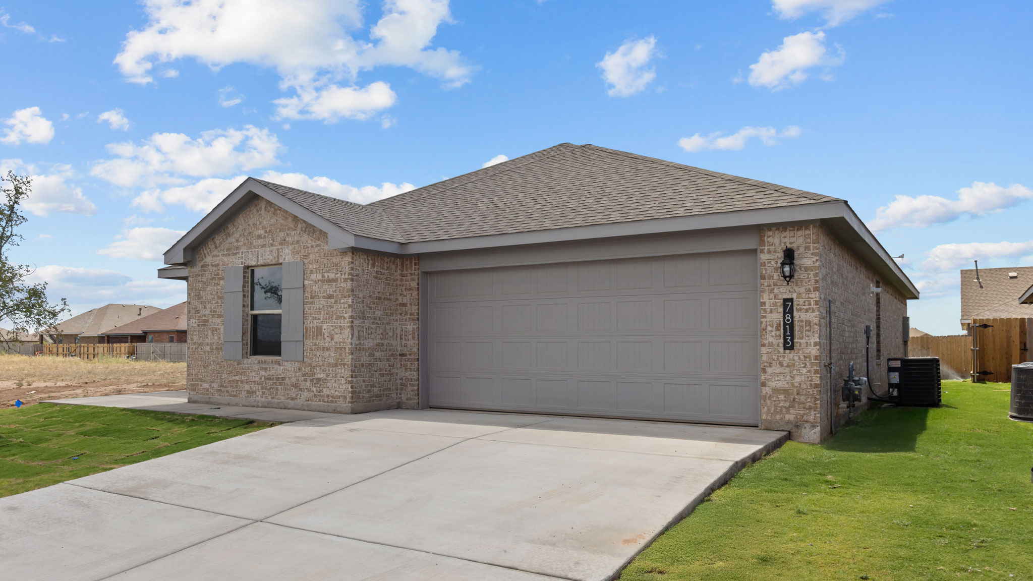 Single story classic brick home with front entry