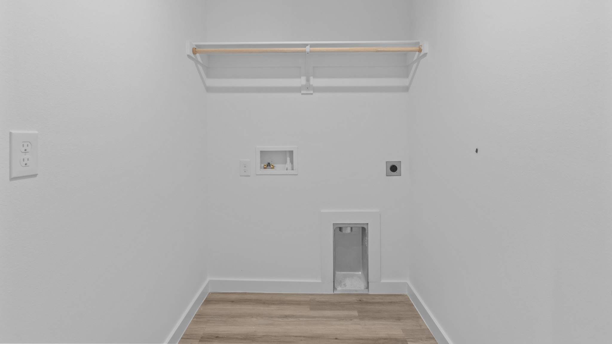 Laundry room and utility closet space with extra storage