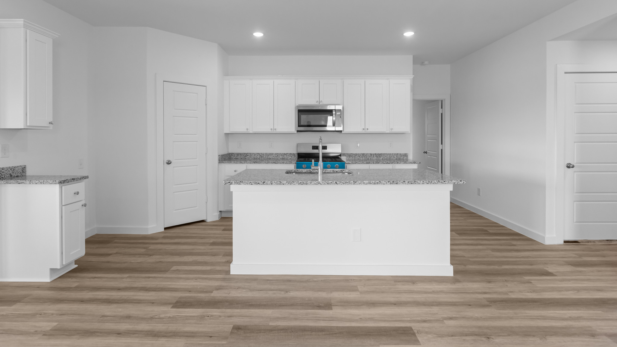 Spacious open concept kitchen with island and counter prep space