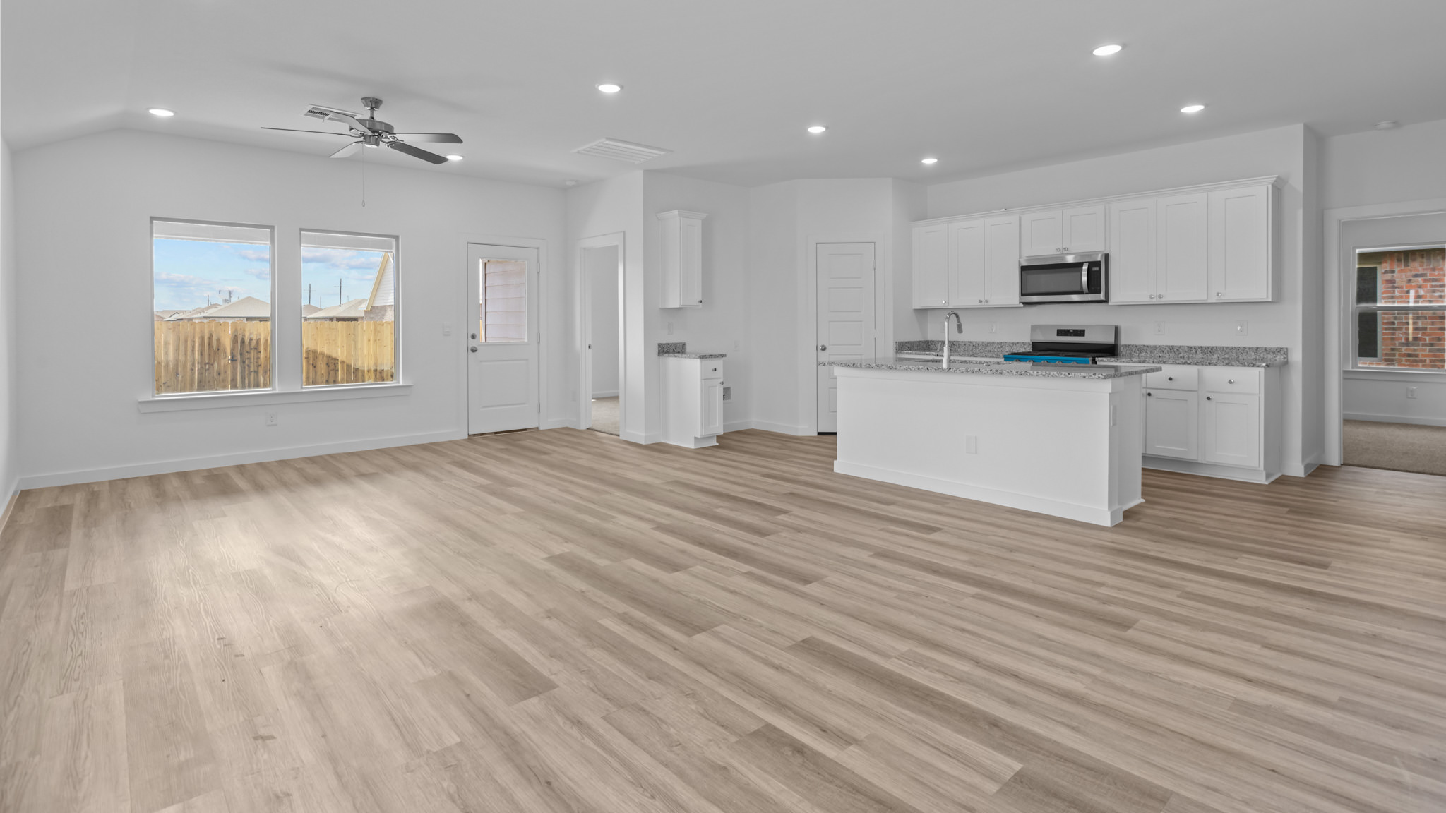 Open concept kitchen, living, family, and dining room space