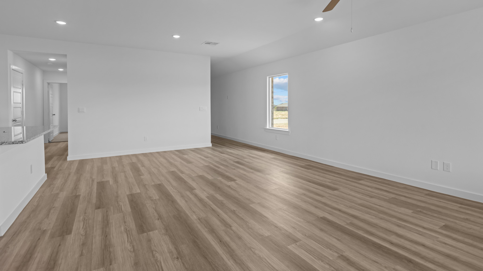 Open living and family room area with ample natural light