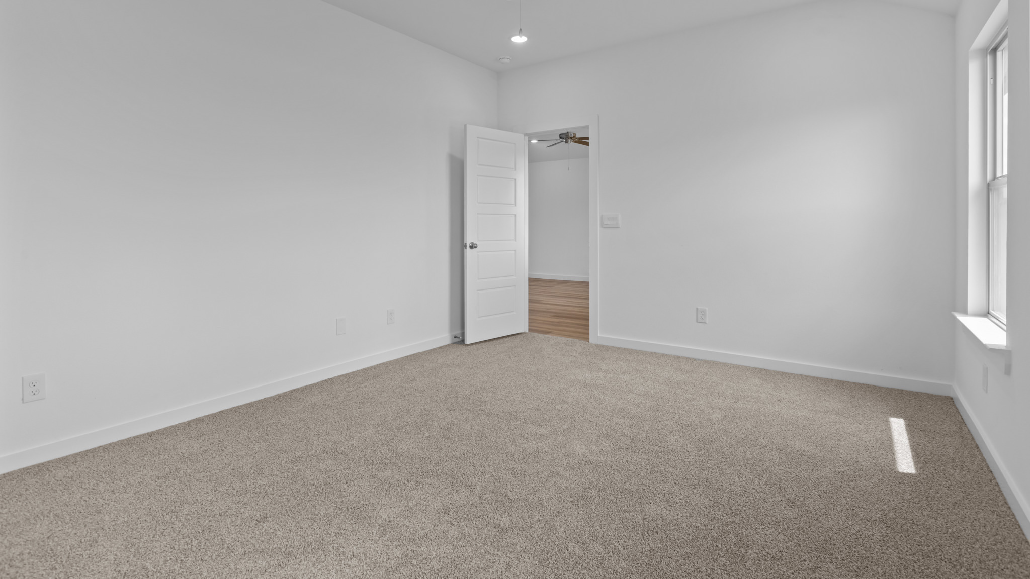 Primary bedroom with private attached bathroom and walk-in closet