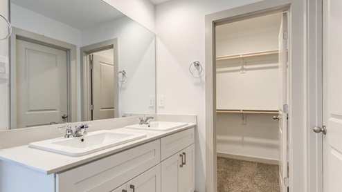 Primary closet connected to bathroom