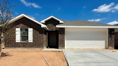Single Story home with brick, covered patio and 2 car garage