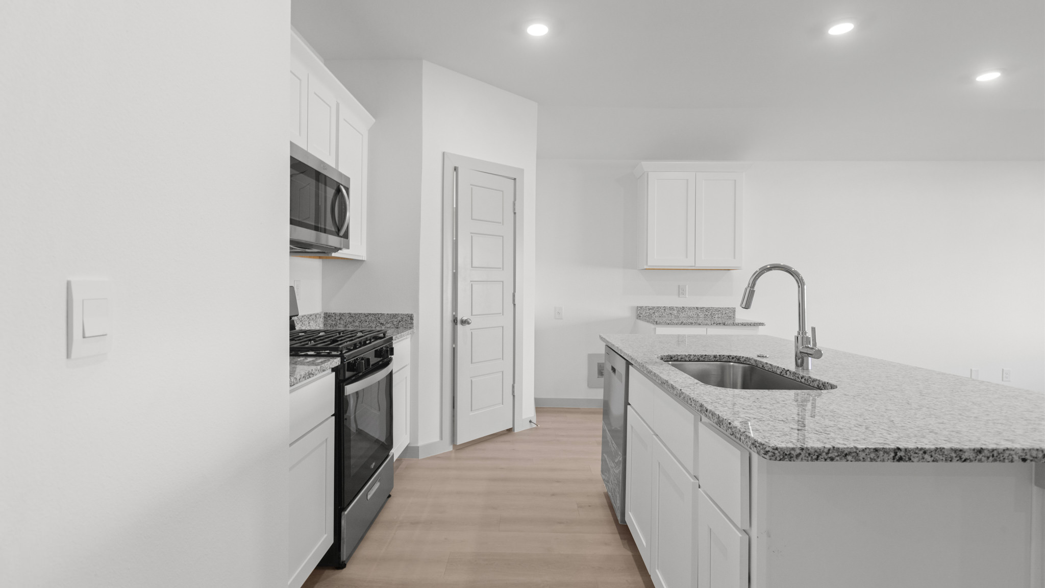 Kitchen with granite counters, recessed lighting and stainless steel appliances