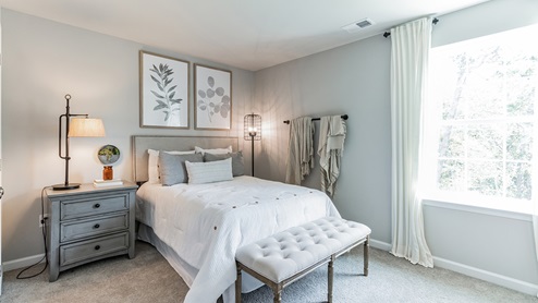 White bedroom with beige carpet
