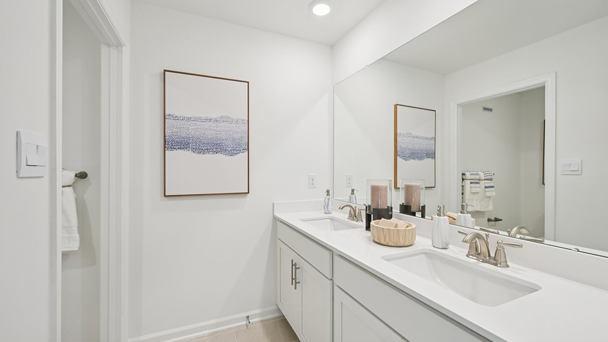 primary bathroom with double vanity sinks