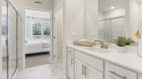 on suite bathroom with glass shower door