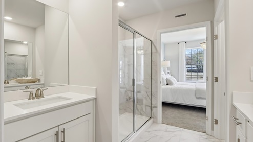 on suite bathroom with glass shower door