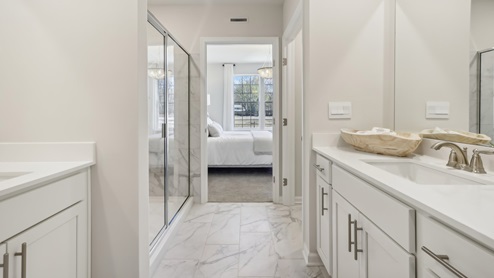 on suite bathroom with glass shower door