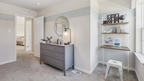 second floor bedroom with beige carpet