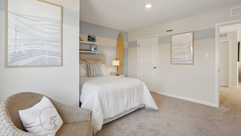 second floor bedroom with beige carpet