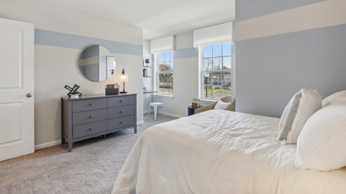 second floor bedroom with beige carpet