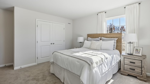 second floor bedroom with beige carpet