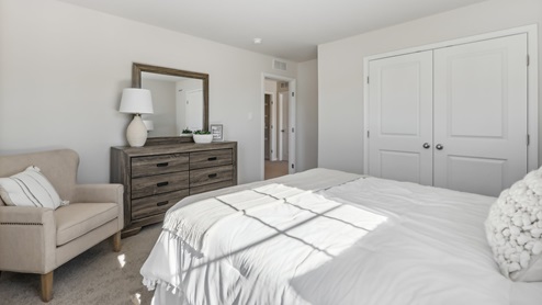 second floor bedroom with beige carpet