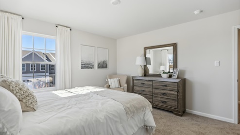 second floor bedroom with beige carpet