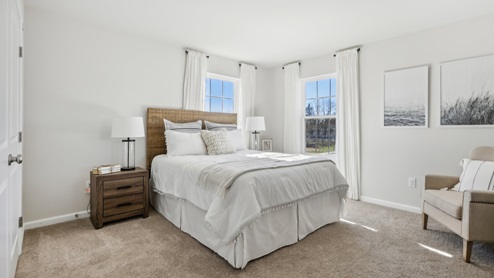 second floor bedroom with beige carpet