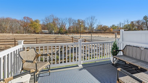 Rear exterior of the model home showing fenced patio