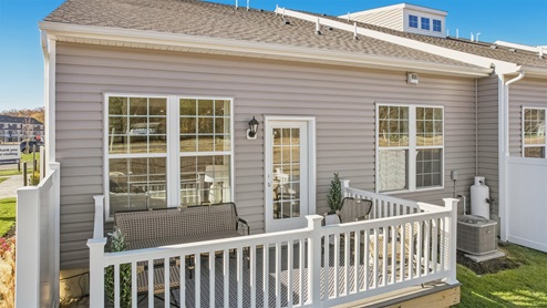 Rear exterior of the model home showing fenced patio
