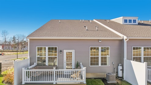 Rear exterior of the model home showing fenced patio
