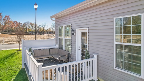 Rear exterior of the model home showing fenced patio