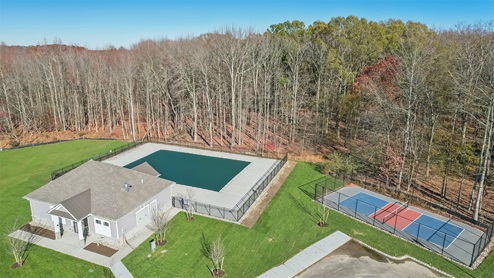 Aerial photo of tennis court and pool house