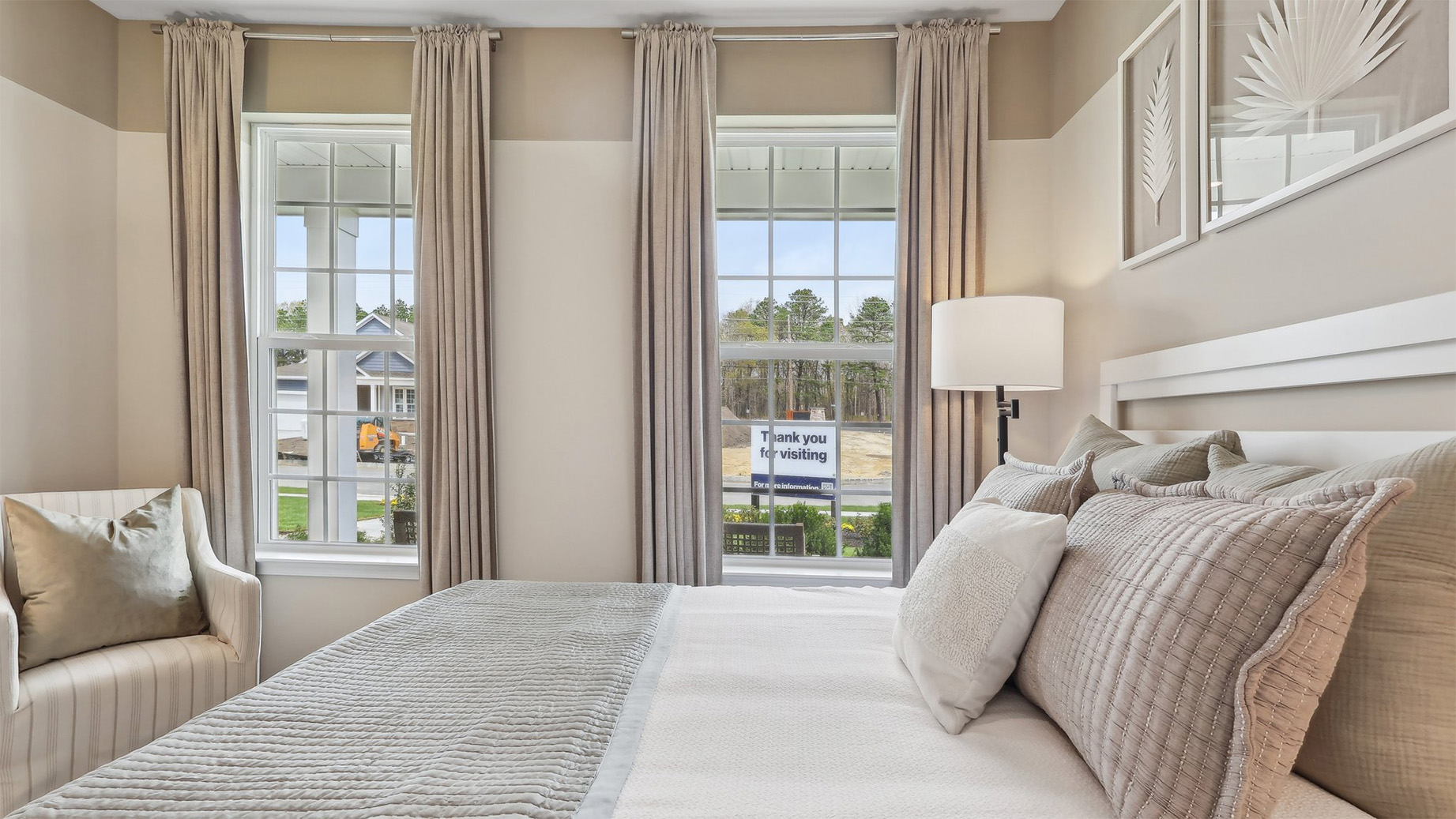 spacious bedroom with large windows