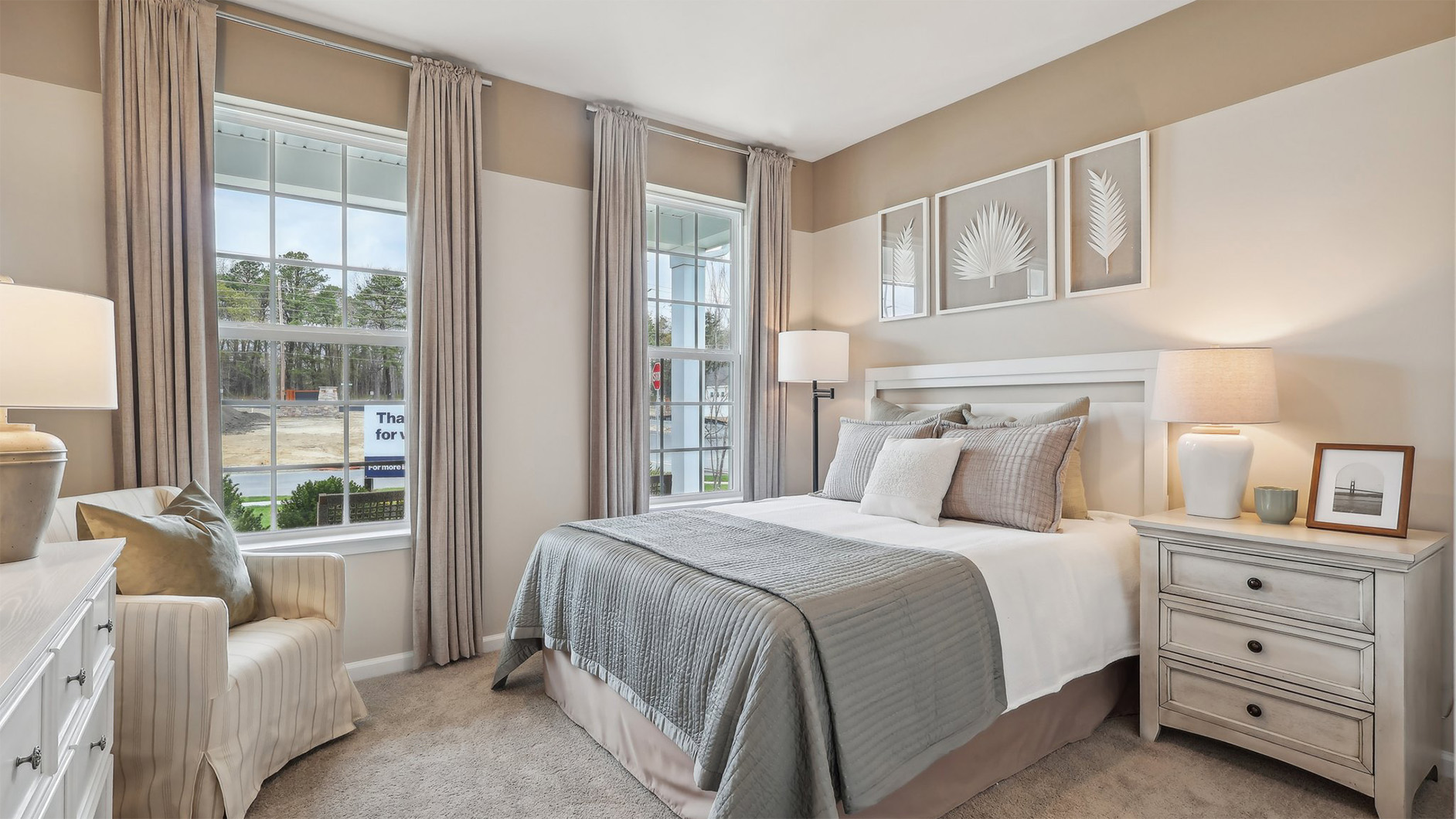 spacious bedroom with large windows