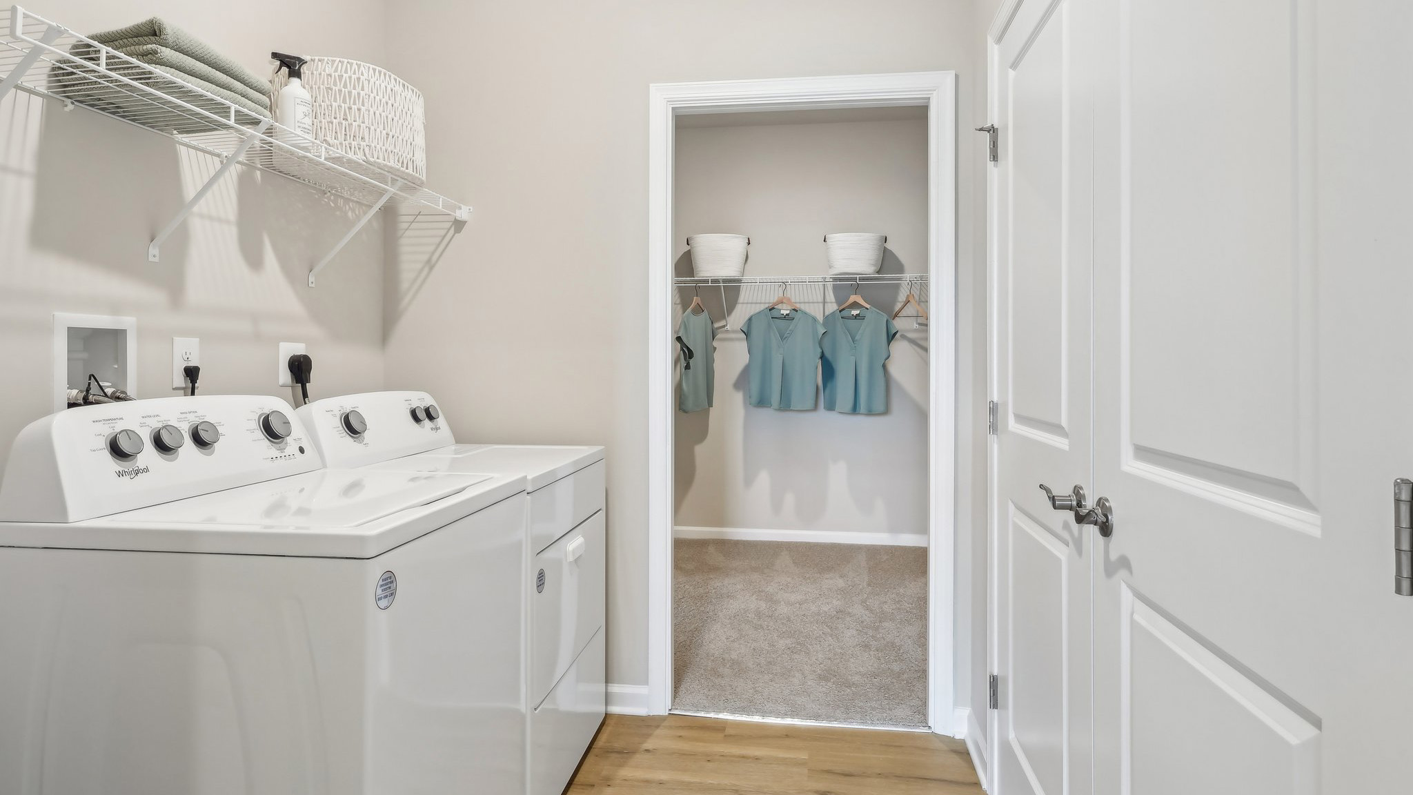 laundry room off the primary walk in closet for convenience