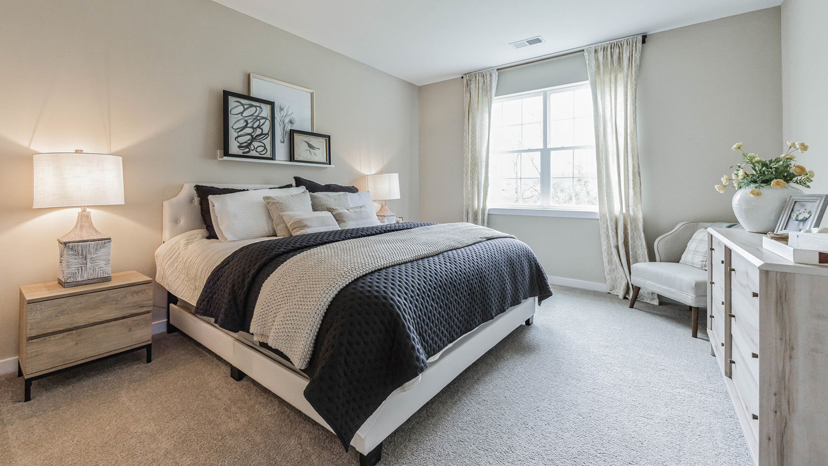 white bedroom with beige carpet