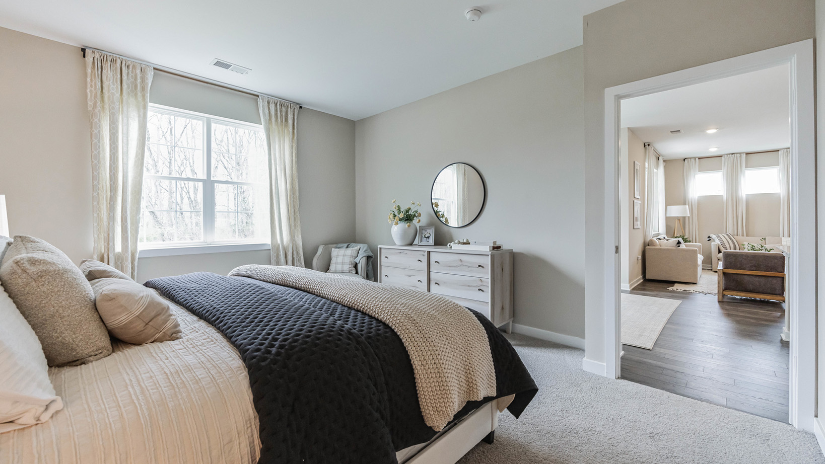 white bedroom with beige carpet