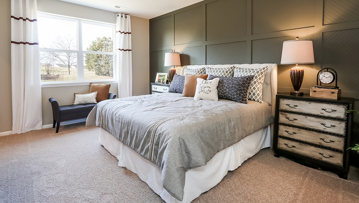 bedroom with beige carpet