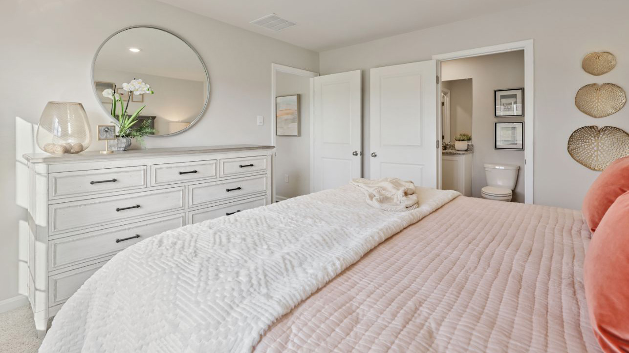 primary bedroom off the living room with ample space